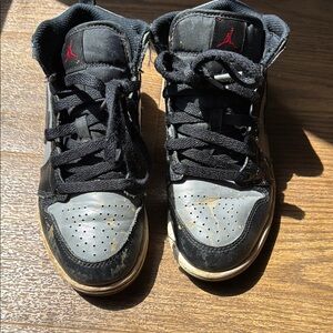 Black and Gray Sneakers with Red Logo Retro 1s